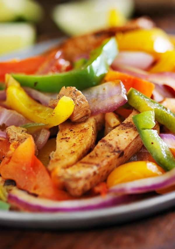 Air fryer keto chicken fajitas. These keto chicken fajitas are made in the air fryer. They're low-carb, gluten-free, and have a spicy kick. #lowcarb #keto #chicken #recipes #fajitas, #dinner #healthy #homemade #airfryer